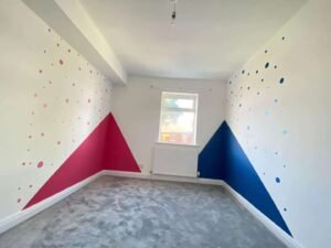 Children’s Bedroom with Pink and Blue Geometric Walls