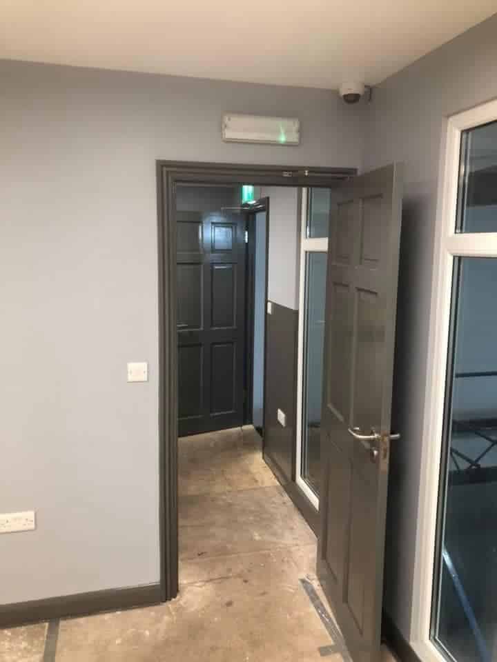 Commercial Corridor and Door Repainting in Grey — after