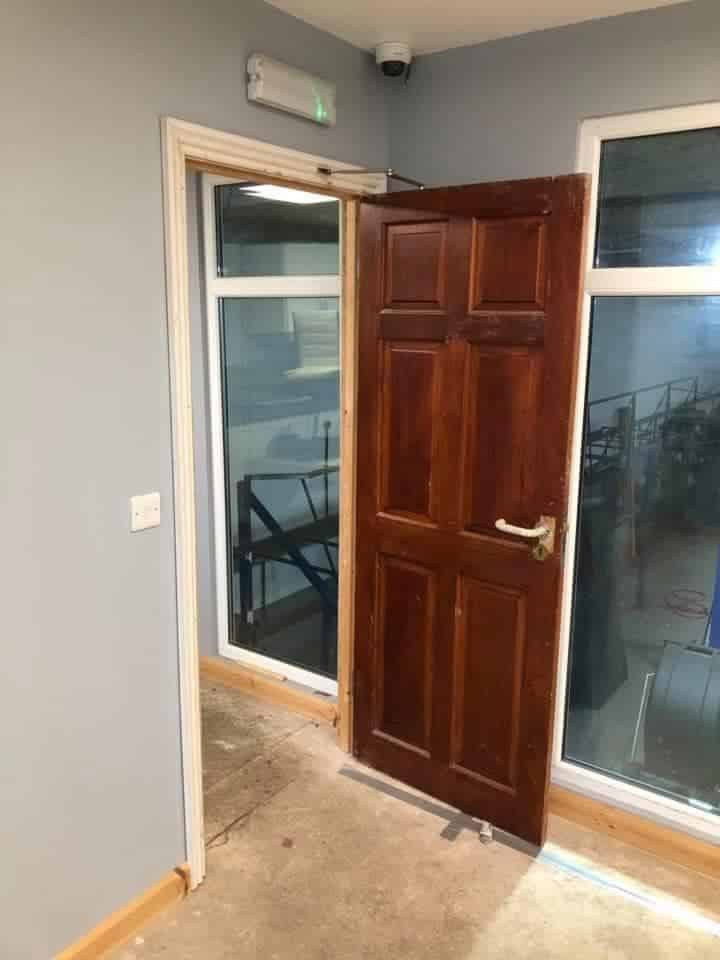Commercial Corridor and Door Repainting in Grey — before