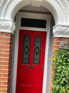 Red Front Door with an Arched Period Surround