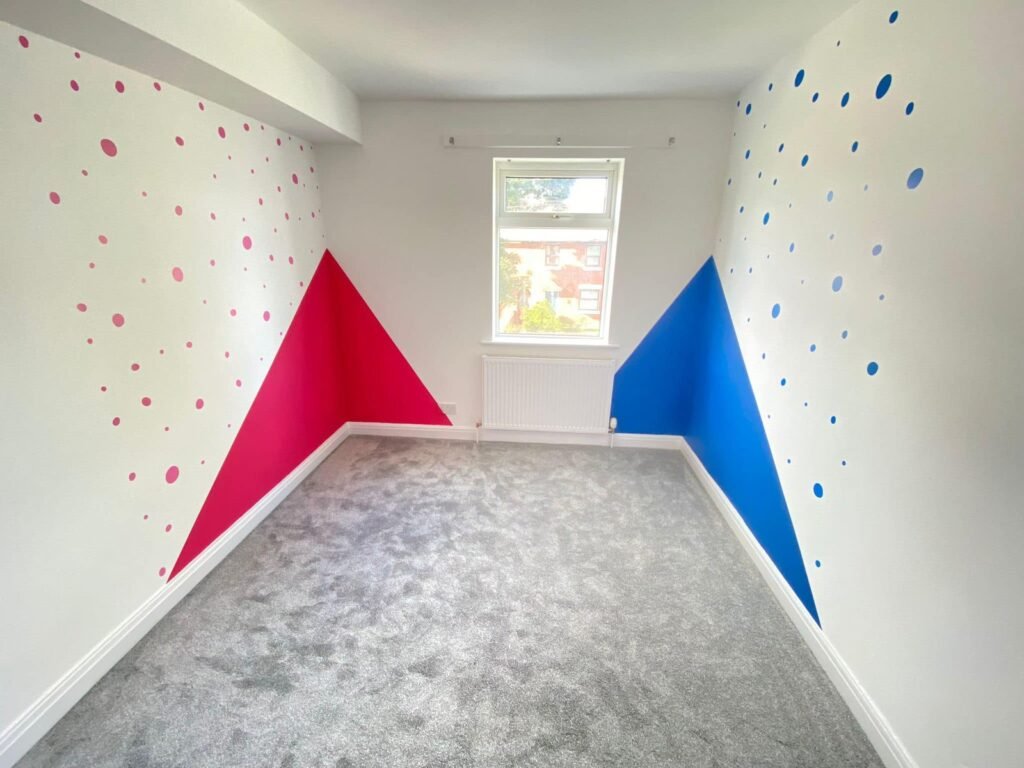 Children’s Bedroom with Pink and Blue Geometric Walls