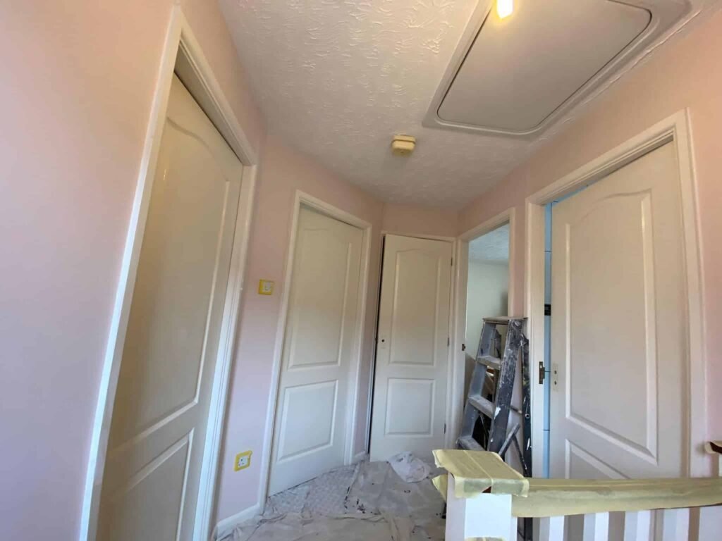 Panelled Landing and Door-Frame Redecoration — before