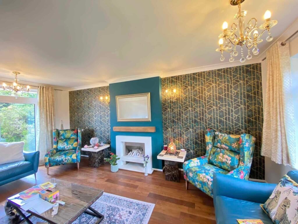 Teal Living Room with Geometric Feature Wallpaper