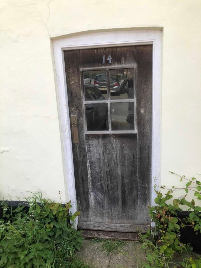 Red Cottage Door – Preparation and Repainting — before