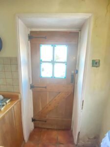 Half-Glazed Back Door Repainted in White