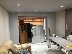 Living Room Wallpapering with a Textured Grey Finish
