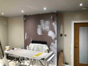 Living Room Wallpapering with a Textured Grey Finish
