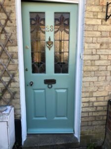 Period Front Door Repainting in Muted Teal
