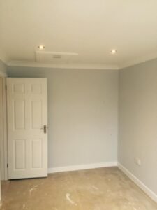New-Build Interior Painting with a Vaulted Stairwell