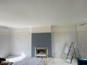 Teal Living Room with Geometric Feature Wallpaper