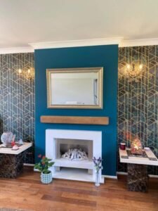 Teal Living Room with Geometric Feature Wallpaper