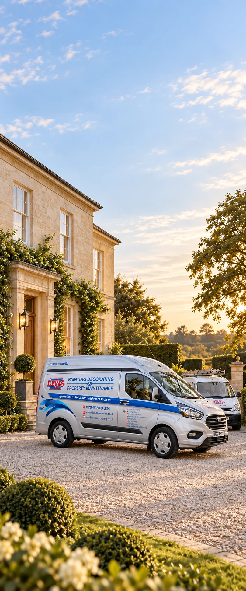 Elvis Decorating vans outside a stone house